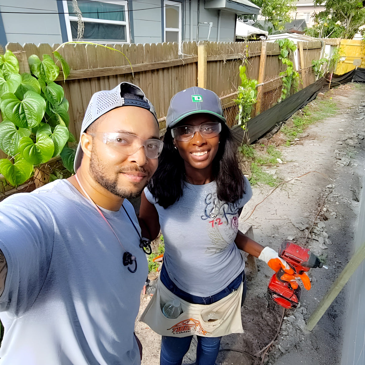 Jermaine and Toni Jefferson building a fence together